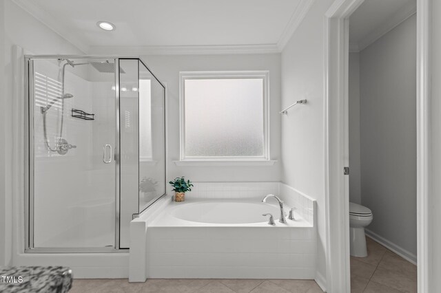 full bathroom featuring a stall shower, a garden tub, toilet, tile patterned flooring, and ornamental molding