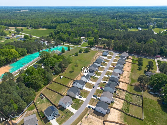 drone / aerial view featuring a view of trees