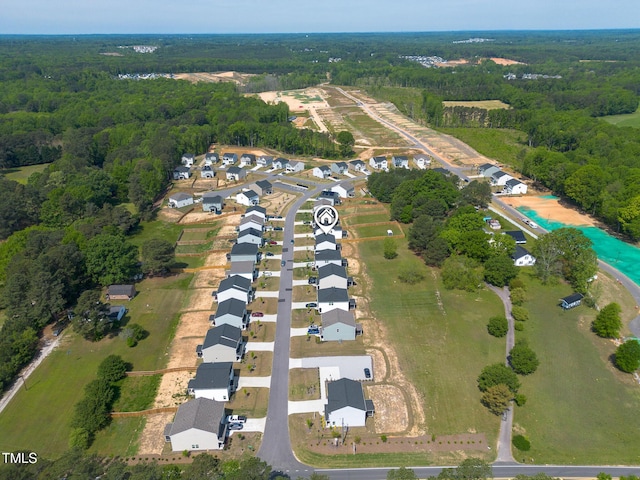 bird's eye view featuring a residential view and a view of trees