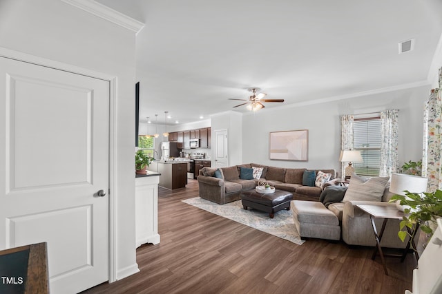 living area featuring recessed lighting, ornamental molding, visible vents, a ceiling fan, and dark wood-type flooring