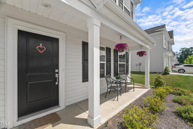 doorway to property featuring covered porch