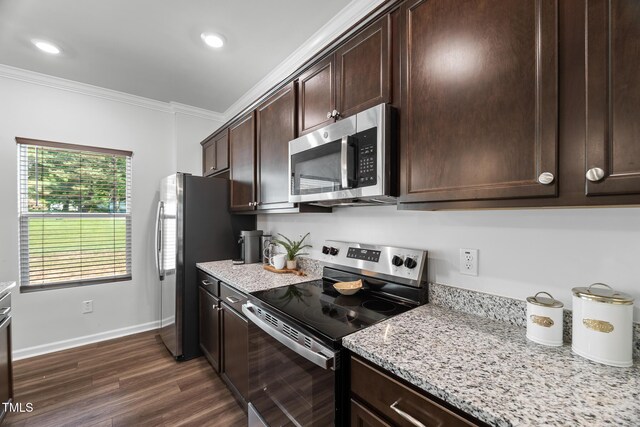 kitchen featuring dark wood finished floors, light stone countertops, appliances with stainless steel finishes, dark brown cabinets, and crown molding