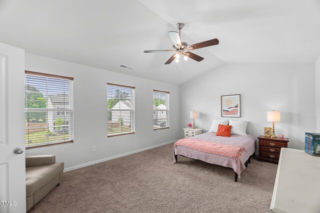 bedroom with carpet flooring, baseboards, a ceiling fan, and lofted ceiling