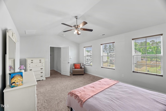 carpeted bedroom with visible vents, ceiling fan, lofted ceiling, and baseboards