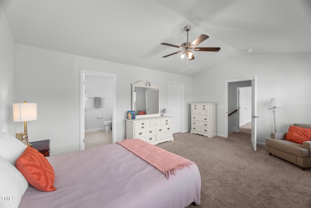 bedroom with connected bathroom, light colored carpet, vaulted ceiling, ceiling fan, and baseboards
