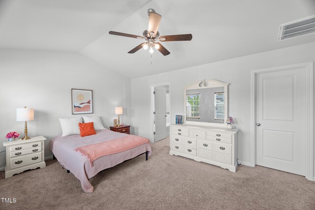 bedroom featuring a ceiling fan, visible vents, vaulted ceiling, and light colored carpet