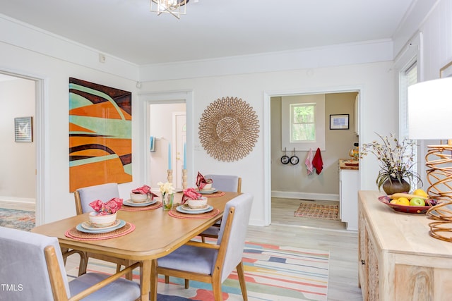 919 Orient St, Durham, NC 27701 - dining space featuring light wood finished floors, baseboards, and ornamental molding