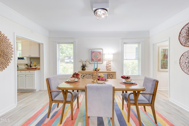 919 Orient St, Durham, NC 27701 - dining area featuring a wealth of natural light, crown molding, light wood-style floors, and baseboards