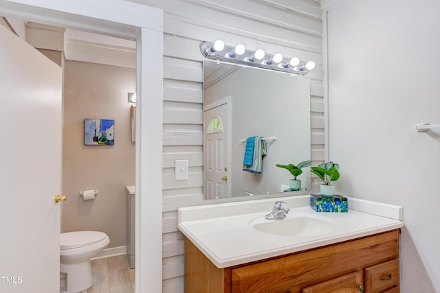 919 Orient St, Durham, NC 27701 - half bathroom with wood finished floors, vanity, and toilet