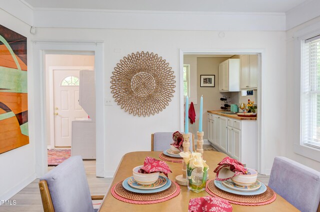 919 Orient St, Durham, NC 27701 - dining room featuring light wood finished floors and crown molding