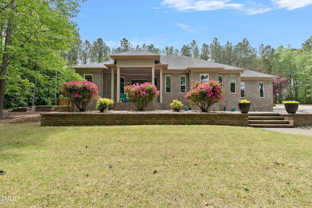 120 Wood Lake Dr, Fuquay Varina, NC 27526 - view of front of property with a front lawn and brick siding