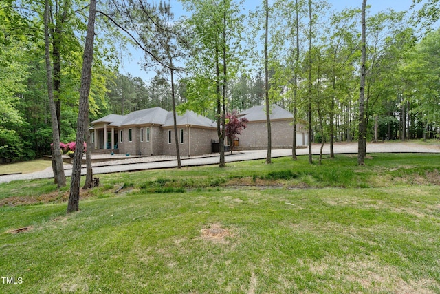 120 Wood Lake Dr, Fuquay Varina, NC 27526 - view of yard featuring a garage