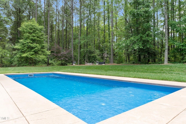 120 Wood Lake Dr, Fuquay Varina, NC 27526 - outdoor pool with a yard and a forest view