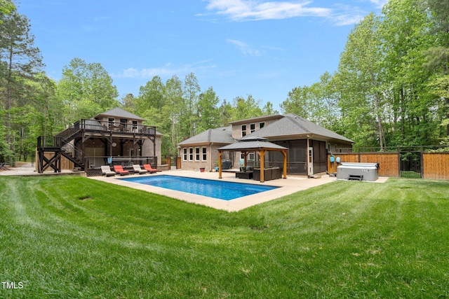 120 Wood Lake Dr, Fuquay Varina, NC 27526 - rear view of house featuring stairway, a gazebo, a hot tub, and a yard