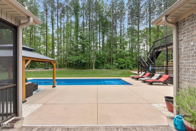 120 Wood Lake Dr, Fuquay Varina, NC 27526 - outdoor pool featuring stairway, a gazebo, a yard, and a patio