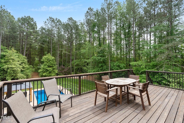 120 Wood Lake Dr, Fuquay Varina, NC 27526 - wooden deck featuring outdoor dining space and an outdoor pool
