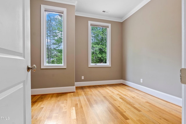 120 Wood Lake Dr, Fuquay Varina, NC 27526 - spare room with light wood-type flooring, visible vents, baseboards, and ornamental molding