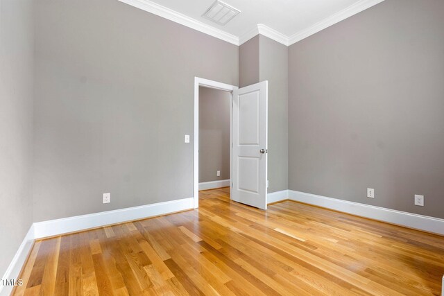 120 Wood Lake Dr, Fuquay Varina, NC 27526 - spare room with light wood-style floors, visible vents, baseboards, and ornamental molding