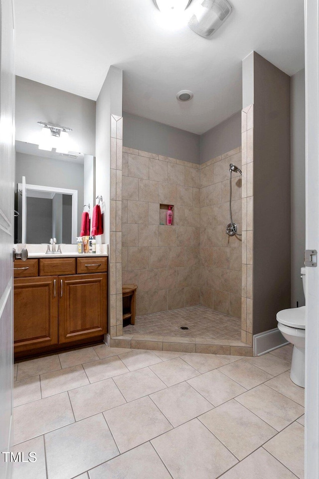120 Wood Lake Dr, Fuquay Varina, NC 27526 - full bathroom with tile patterned floors, toilet, vanity, and a walk in shower