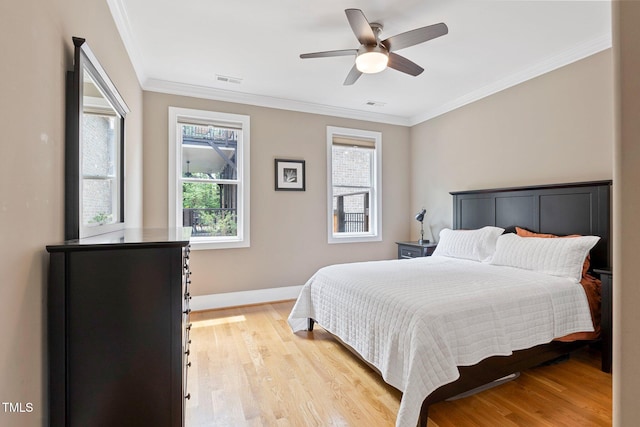 120 Wood Lake Dr, Fuquay Varina, NC 27526 - bedroom featuring crown molding, visible vents, and light wood-type flooring