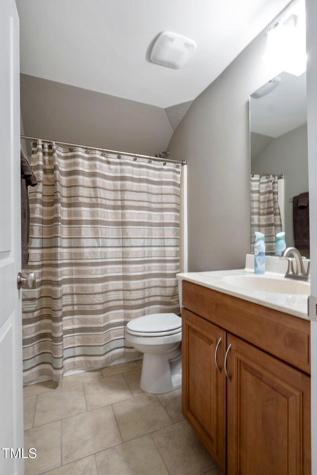 120 Wood Lake Dr, Fuquay Varina, NC 27526 - full bath featuring curtained shower, lofted ceiling, tile patterned floors, toilet, and vanity