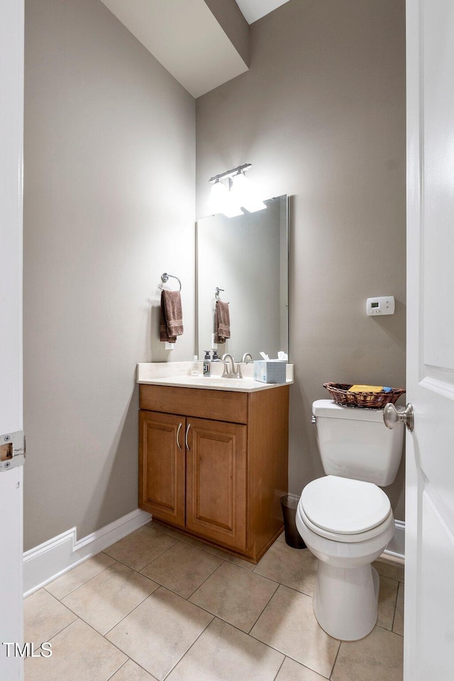 120 Wood Lake Dr, Fuquay Varina, NC 27526 - half bathroom with baseboards, toilet, vanity, and tile patterned floors