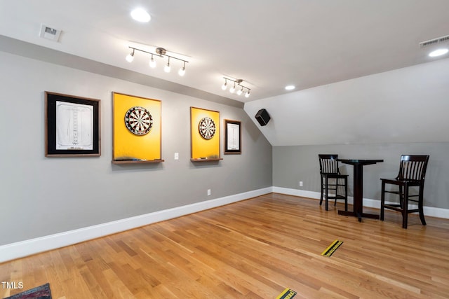 120 Wood Lake Dr, Fuquay Varina, NC 27526 - additional living space featuring wood finished floors, visible vents, vaulted ceiling, and baseboards