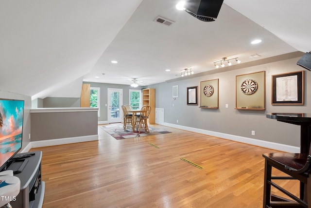 120 Wood Lake Dr, Fuquay Varina, NC 27526 - interior space featuring lofted ceiling, visible vents, a ceiling fan, baseboards, and light wood-style flooring