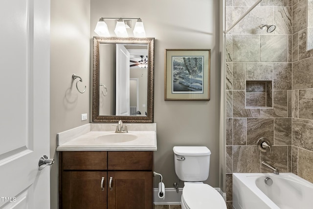 bathroom featuring toilet, shower / bathing tub combination, and vanity