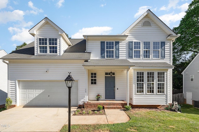 traditional home featuring an attached garage, a shingled roof, central AC, and driveway