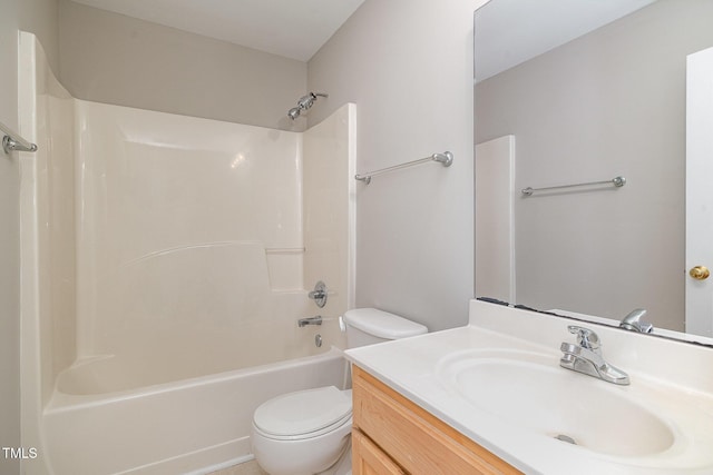 bathroom featuring vanity, toilet, and bathing tub / shower combination