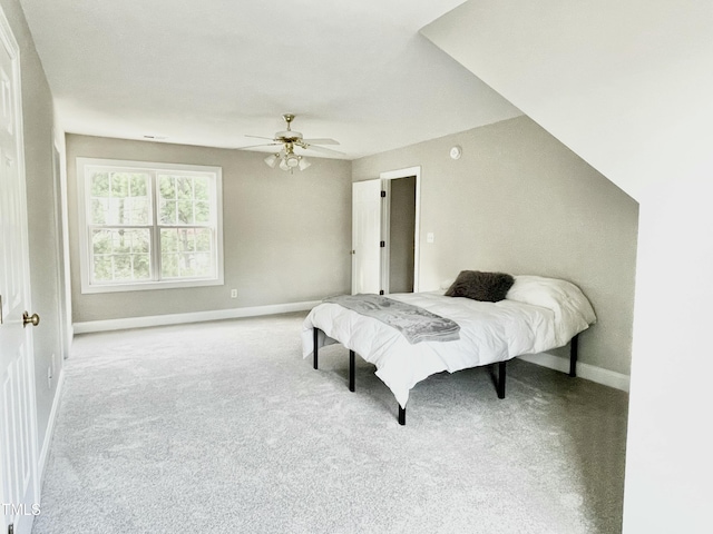 carpeted bedroom with baseboards and ceiling fan