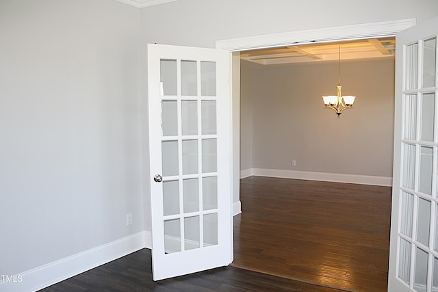 5004 Clowser Minnow Ct, Wake Forest, NC 27587 - spare room featuring a chandelier and dark wood-type flooring