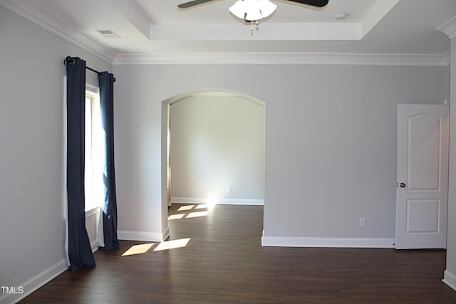 5004 Clowser Minnow Ct, Wake Forest, NC 27587 - unfurnished room featuring arched walkways, a tray ceiling, dark wood-type flooring, and a ceiling fan