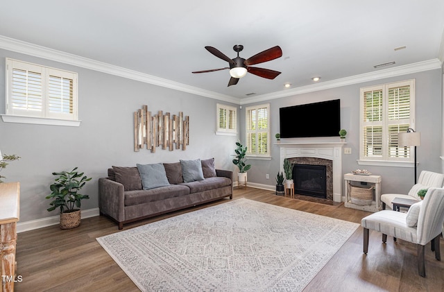 1209 Shasta Daisy Dr, Wake Forest, NC 27587 - living room featuring a ceiling fan, wood finished floors, crown molding, baseboards, and a high end fireplace