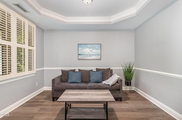 1209 Shasta Daisy Dr, Wake Forest, NC 27587 - living area featuring a raised ceiling, wood finished floors, ornamental molding, and baseboards