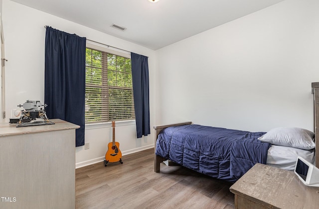 1209 Shasta Daisy Dr, Wake Forest, NC 27587 - bedroom featuring wood finished floors and baseboards