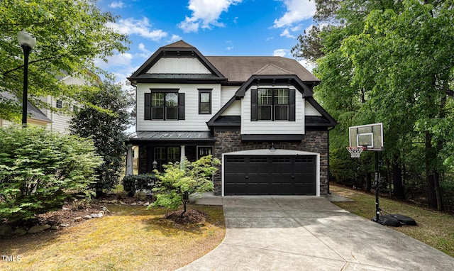 1209 Shasta Daisy Dr, Wake Forest, NC 27587 - view of front of home featuring stone siding, driveway, an attached garage, board and batten siding, and metal roof