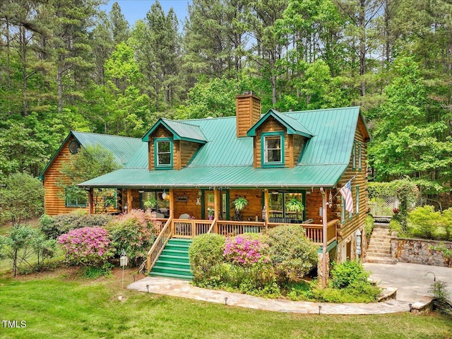 3009 Pleasant Hill Church Rd, Siler City, NC 27344 - view of front of property featuring a chimney, stairway, covered porch, log exterior, and a front lawn
