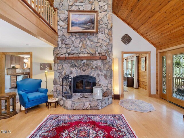 3009 Pleasant Hill Church Rd, Siler City, NC 27344 - living room with high vaulted ceiling, wood finished floors, a stone fireplace, baseboards, and wood ceiling