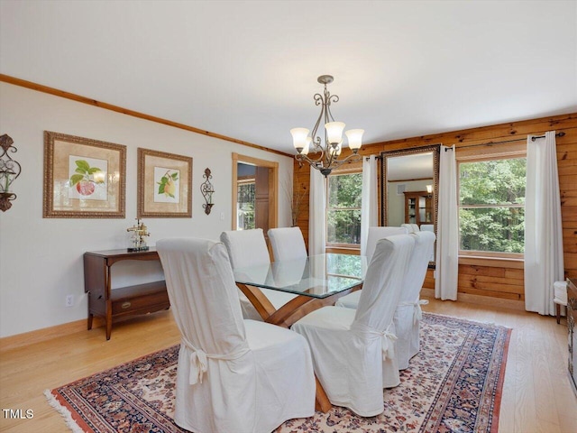 3009 Pleasant Hill Church Rd, Siler City, NC 27344 - dining space featuring a chandelier, light wood-style flooring, healthy amount of natural light, and ornamental molding