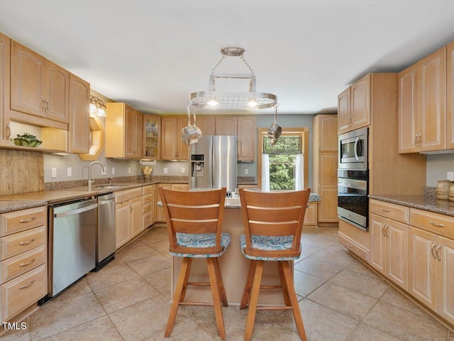 3009 Pleasant Hill Church Rd, Siler City, NC 27344 - kitchen with stainless steel appliances, a sink, a kitchen island, a kitchen breakfast bar, and glass insert cabinets