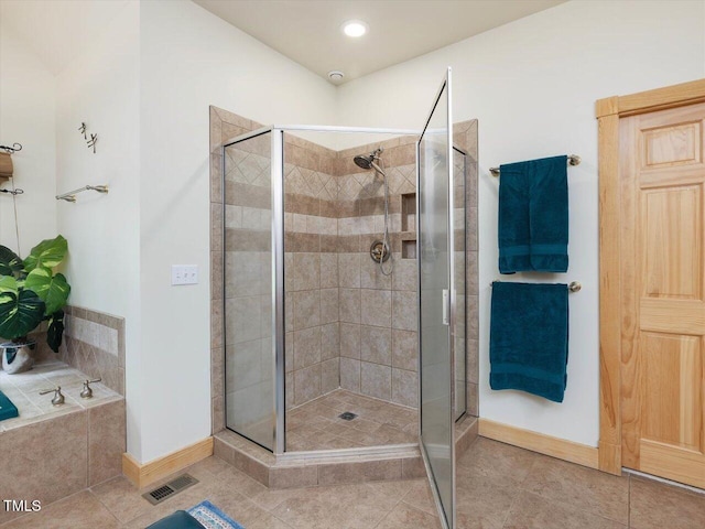 3009 Pleasant Hill Church Rd, Siler City, NC 27344 - full bath with a shower stall, baseboards, tile patterned floors, and a bath