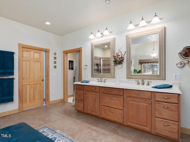 3009 Pleasant Hill Church Rd, Siler City, NC 27344 - bathroom featuring double vanity, a shower with door, baseboards, and tile patterned floors