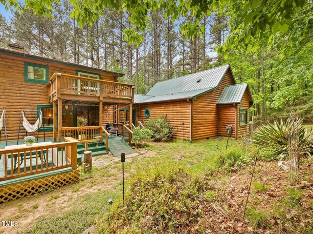 3009 Pleasant Hill Church Rd, Siler City, NC 27344 - back of property with a wooden deck and metal roof