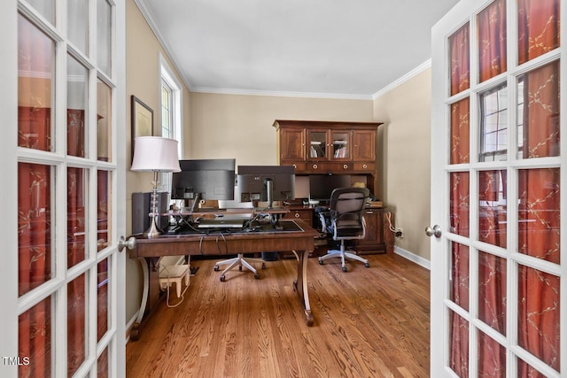office with baseboards, ornamental molding, french doors, and wood finished floors