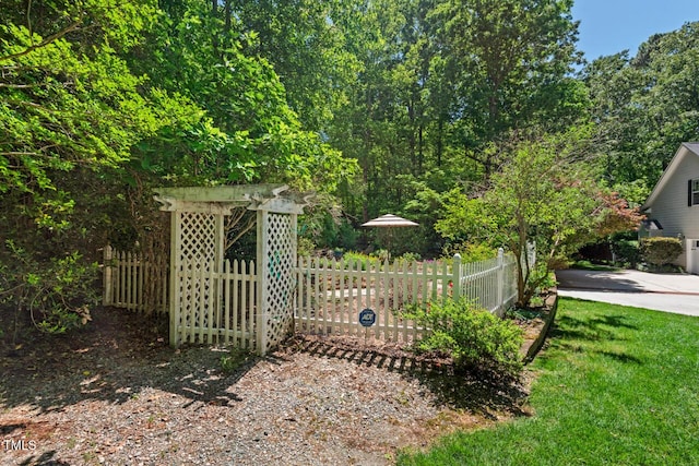 view of gate with fence