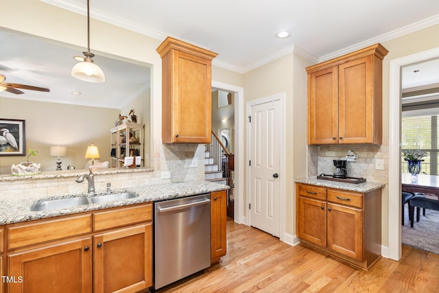 1710 Eddy Ct, Franklinton, NC 27525 - kitchen featuring stainless steel dishwasher, a sink, tasteful backsplash, light wood finished floors, and light stone countertops