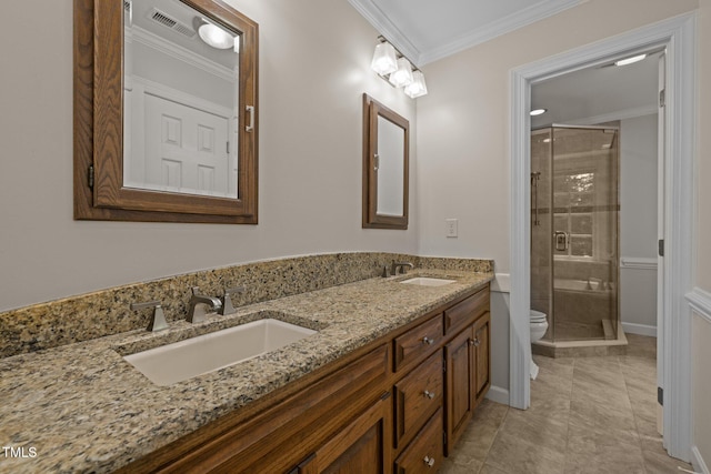 full bathroom featuring toilet, a shower stall, ornamental molding, double vanity, and tile patterned floors