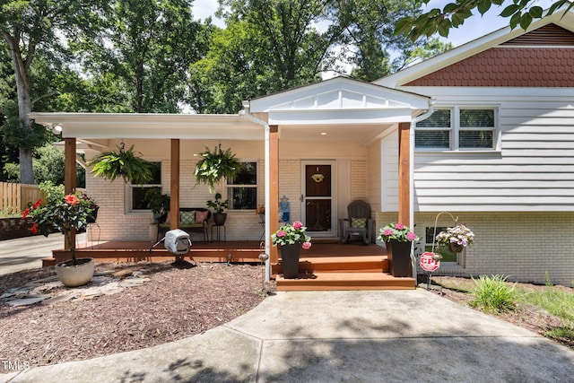 5505 Knollwood Rd, Raleigh, NC 27609 - property entrance with covered porch and brick siding